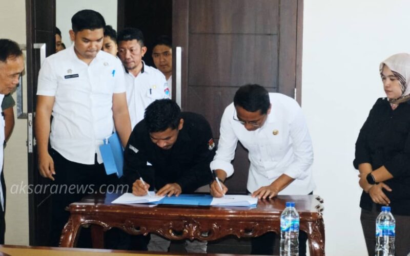 Tandatangani NPHD: Anggaran Pilkada di Boltim Rp 27,7 Miliar